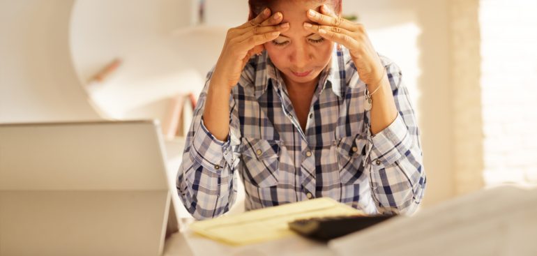 woman looking at tax bill