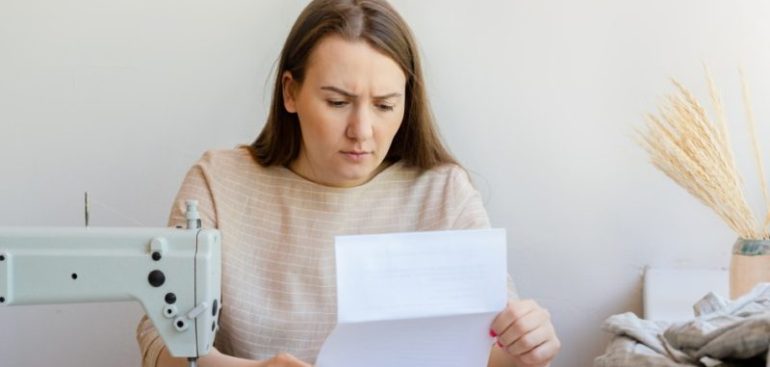 woman upset reading an IRS garnishment notice