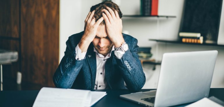 man reading his notice from the IRS