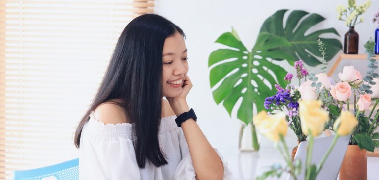 a self-employed woman working in her office